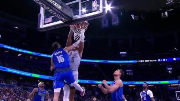 Magic star Paolo Banchero misses a free throw, but corrals the rebound and dunks on Caleb Martin.