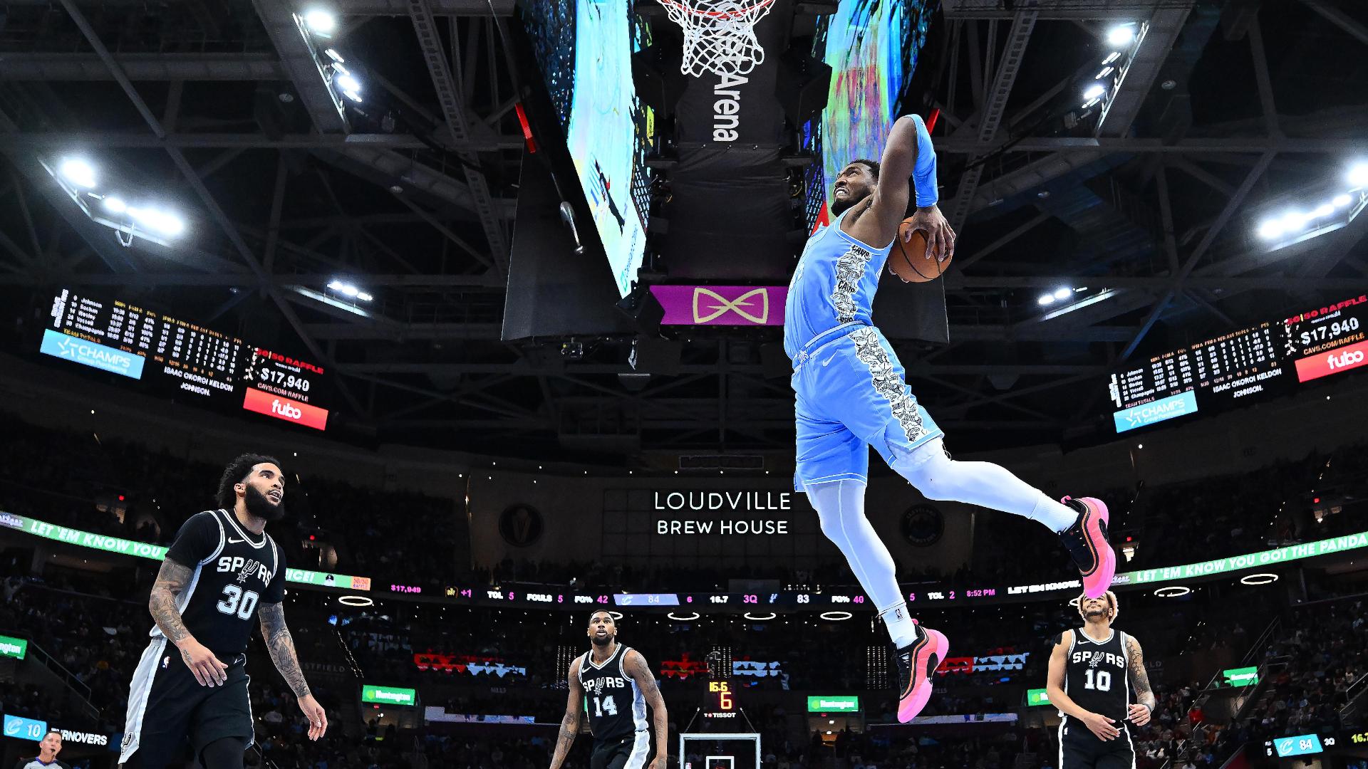Donovan Mitchell crosses up his defender and finishes with a jaw-dropping two-handed slam for Cleveland.