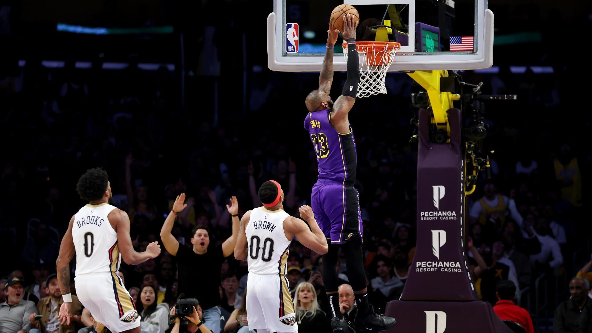 LeBron James soars to slam home an incredible alley-oop for the Los Angeles Lakers.