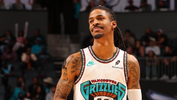 Ja Morant mimics throwing a grenade after cashing a 3 against the Hornets.