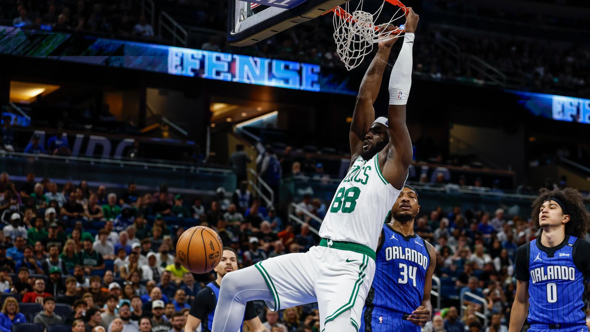 Neemias Queta soars to throw down a big dunk for the Celtics over Wendell Carter Jr.