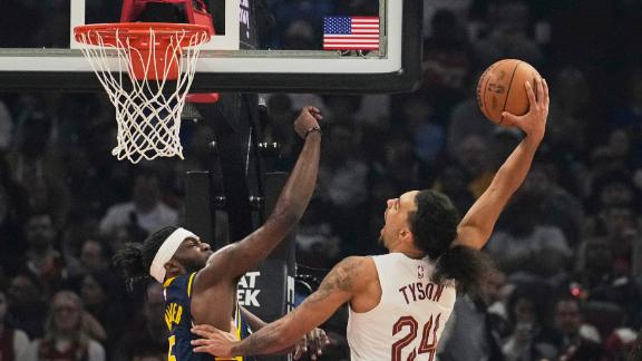 Cavs' rookie Jaylon Tyson gets up high for a powerful slam on top of the Pacers.