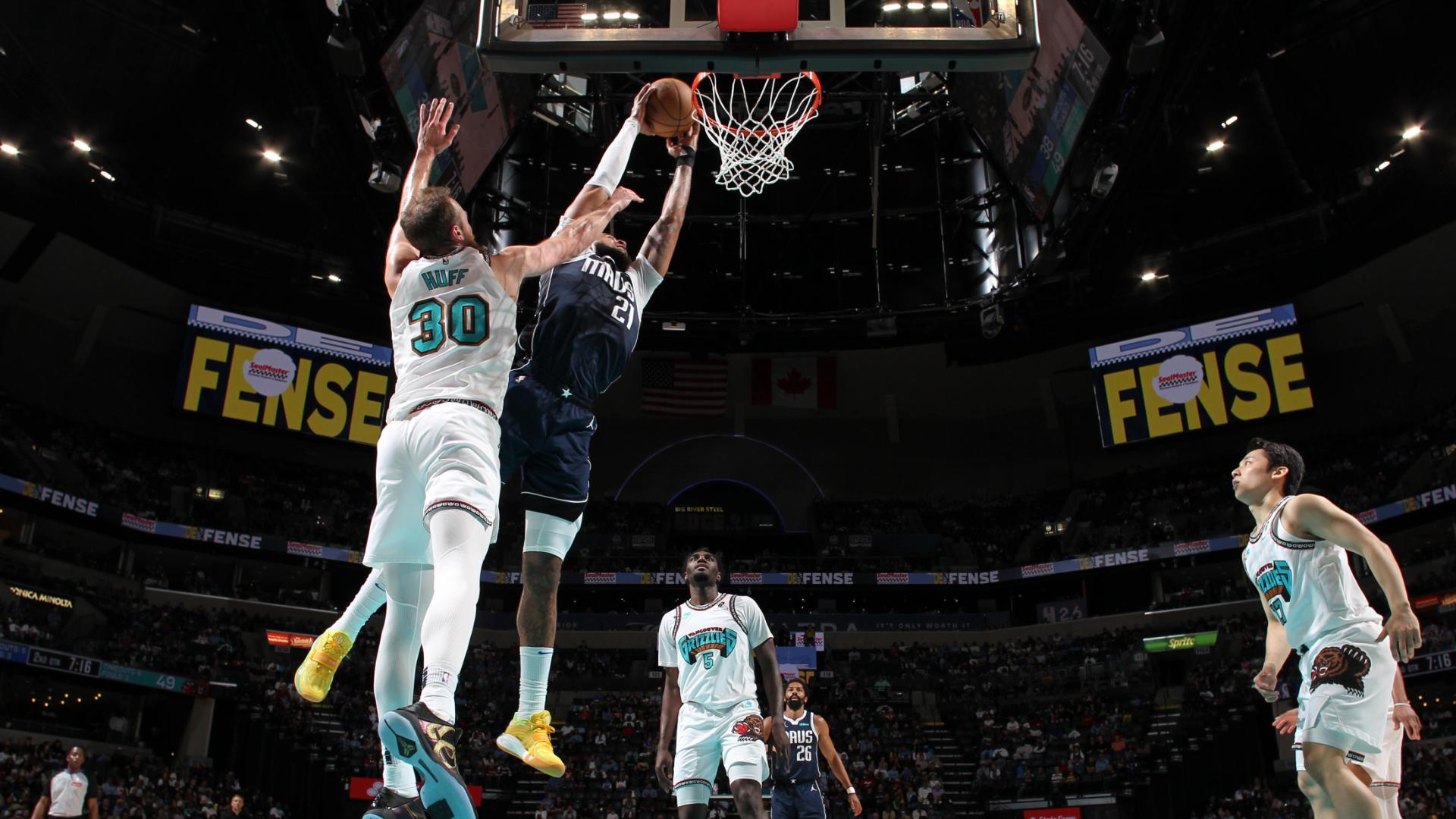 Daniel Gafford hammers a dunk in over his defender in the second quarter for the Mavericks.