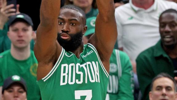 Jaylen Brown pump fakes his defender, sending him flying by as he nails the trey.