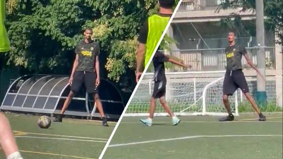 Victor Wembanyama  scores a free kick while playing soccer in Tokyo.