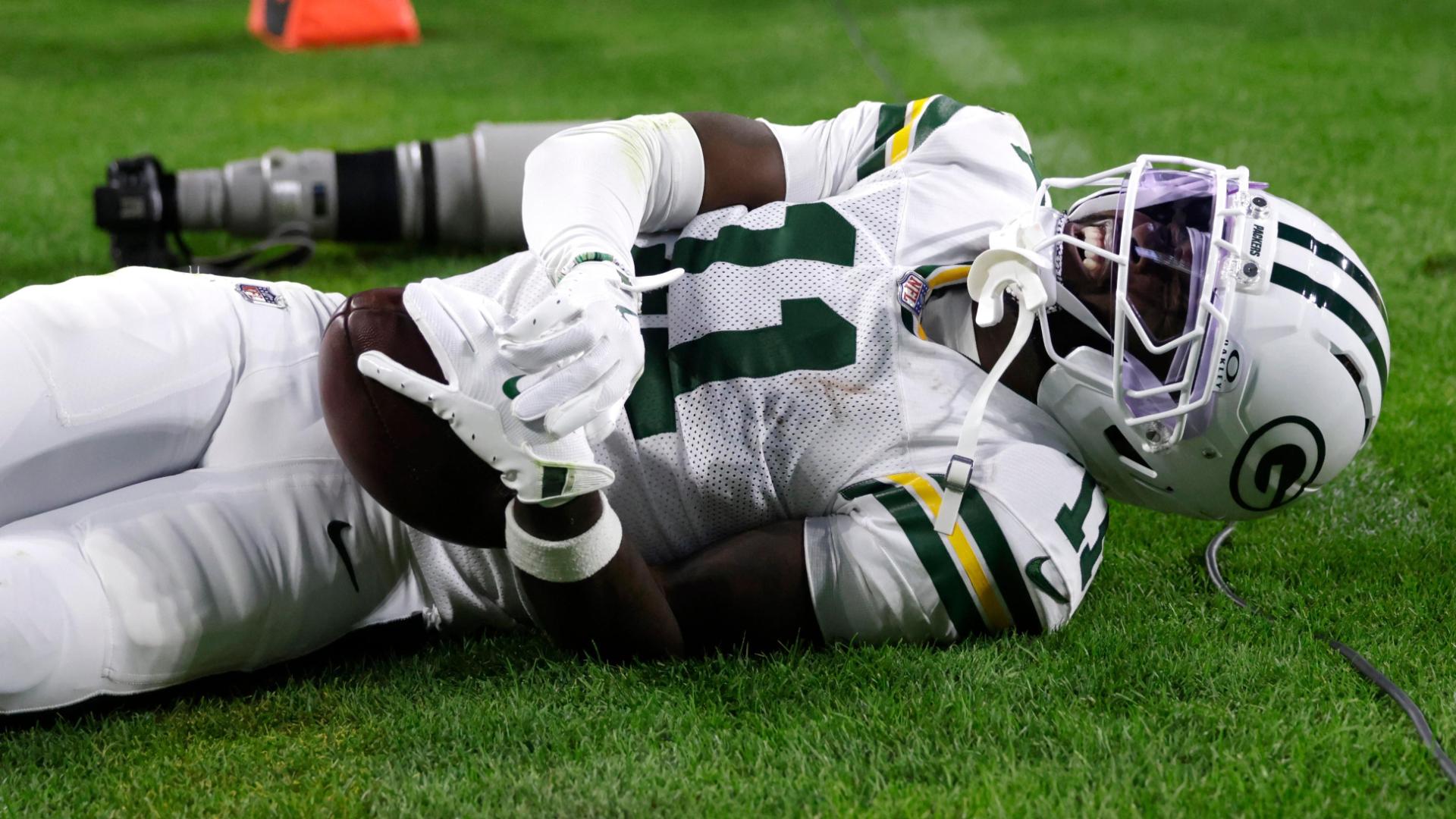 Athlete clutching shoulder in distress