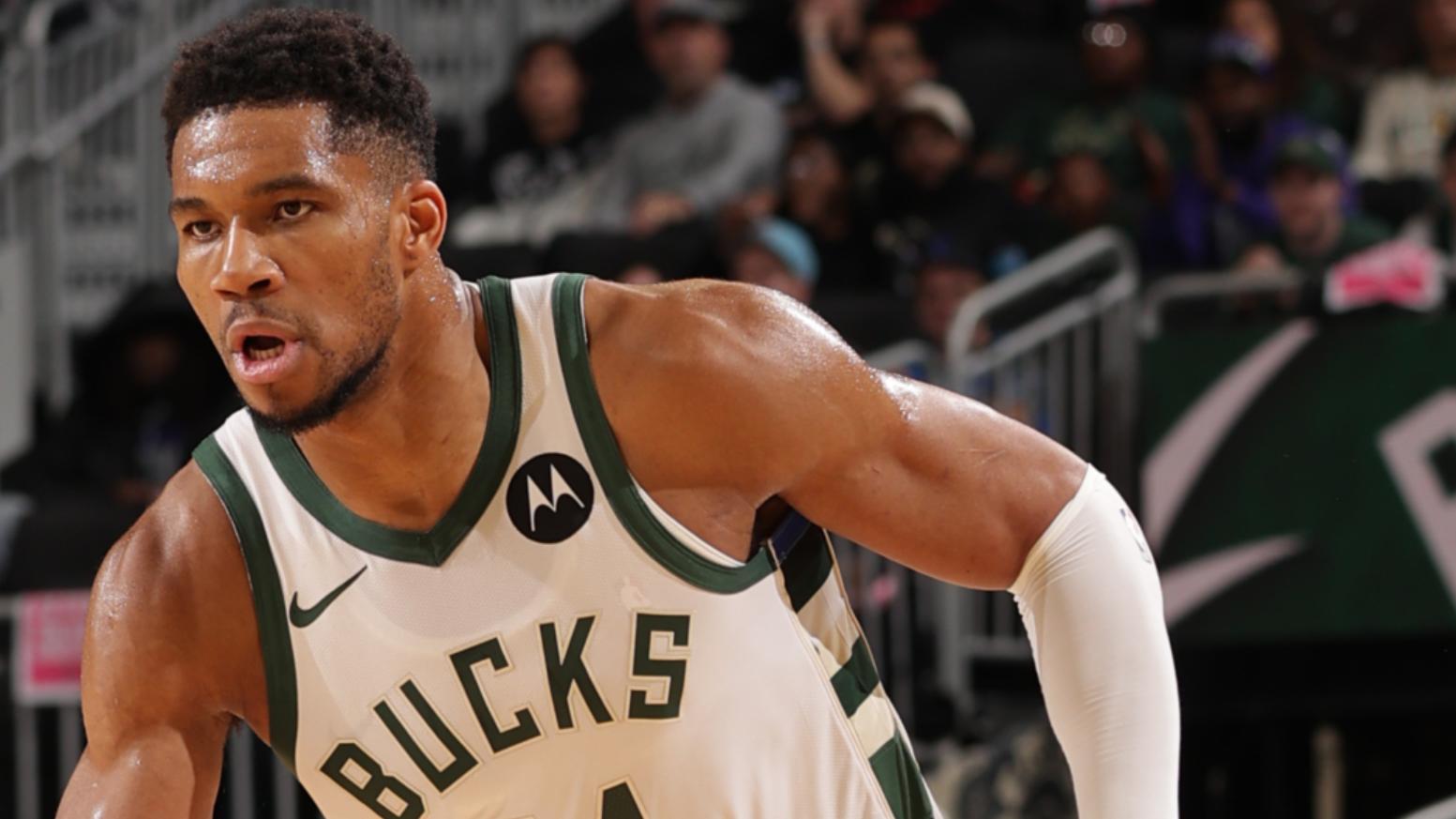 Giannis Antetokounmpo doesn't get called for what looks to be traveling as he drops in a layup at the rim.