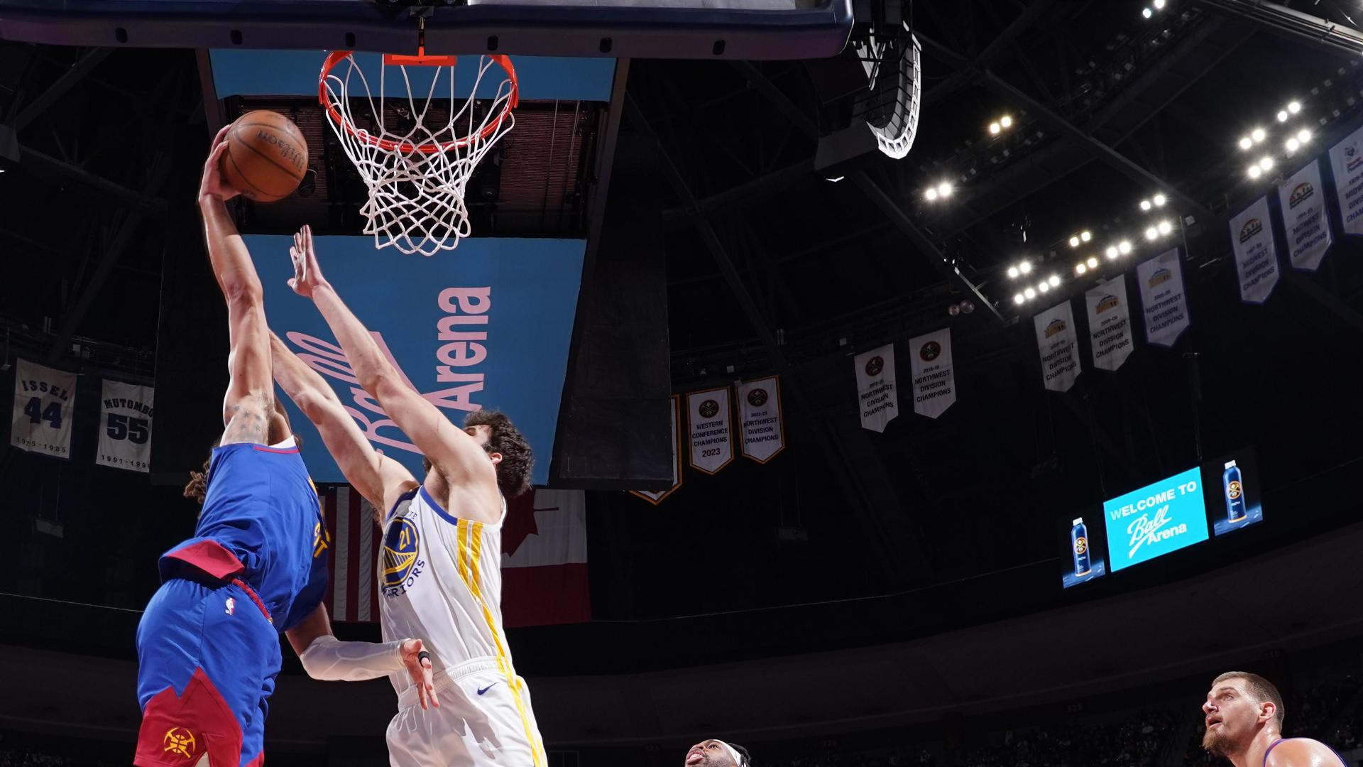 Aaron Gordon rocks the rim after dribbling past Buddy Hield to break free.