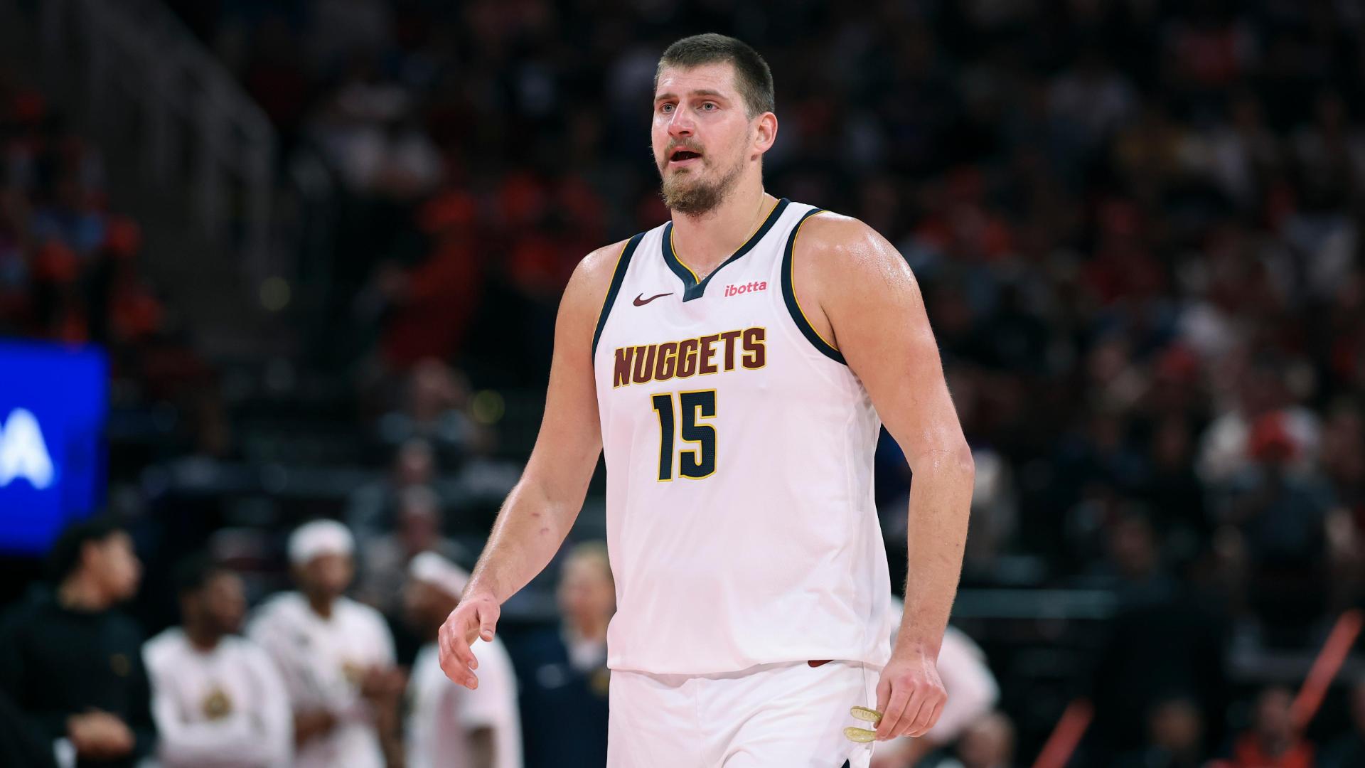 Nikola Jokic gets Alperen Sengun in the air and blows by for a slam over Sengun and Jabari Smith Jr.