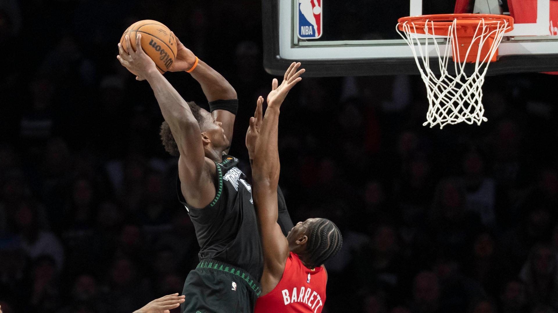 Anthony Edwards dunks on RJ Barrett to pad the Timberwolves' lead.