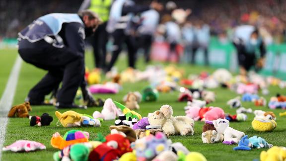 Fans throw thousands of toys onto pitch for disadvantaged children