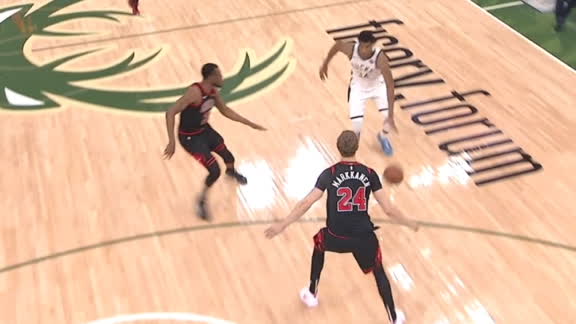 Giannis gets around two defenders for the layup