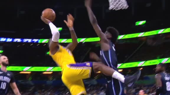 LeBron drops in an off-balanced and-1