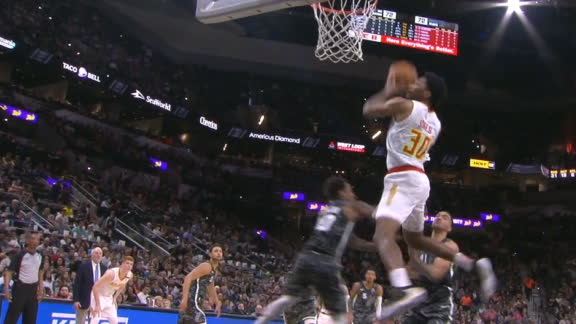 Jones finishes off Trae's lob with a windmill jam
