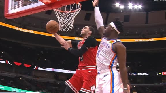 Lavine goes under and around the rim for slam