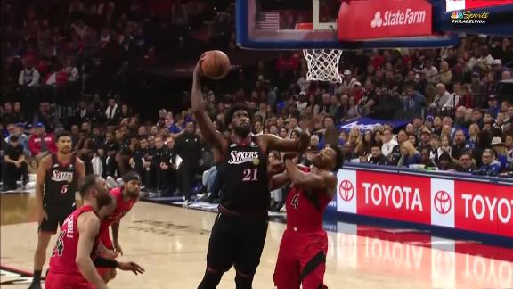 Joel Embiid sinks a bucket and draws a foul for the 76ers.