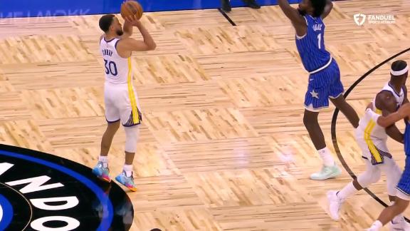 Curry drains a 3-pointer from the logo for the Warriors.