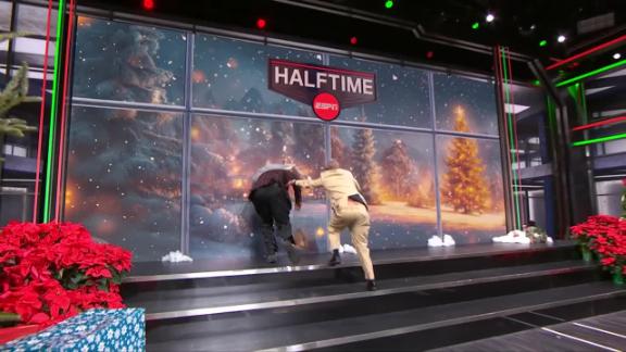 Shaquille O'Neal tries to beat Kenny to the board and "breaks" through the video wall.