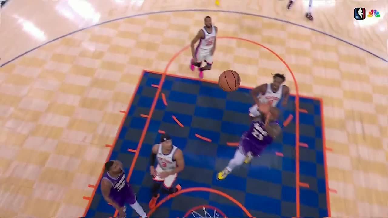 LeBron James quickly gets down the court to finish a lob from teammate Marcus Smart.