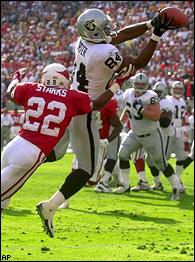 Jerry Porter of the Oakland Raiders runs with the ball after a