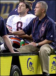 Chicago Bears quarterback Rex Grossman sets to pass in the snow