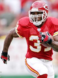 Running back Priest Holmes of the Kansas City Chiefs runs the ball up