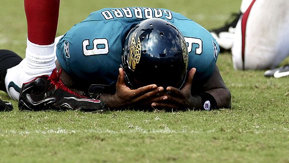 Jacksonville Jaguars quarterback Mark Brunell looks for an open man during  the third quarter ag …