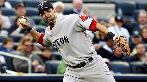 Boston Red Sox's Mike Lowell, right, is joined on the field by his