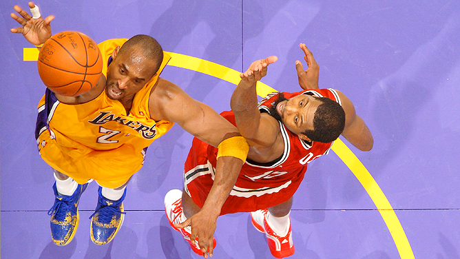 Kobe Bryant of the Los Angeles Lakers drives baseline against Doug News  Photo - Getty Images