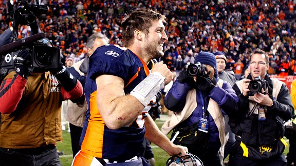 Quarterback Tim Tebow (15) celebrates a score during an NFL game against  the New England Patriots – Denver Broncos History