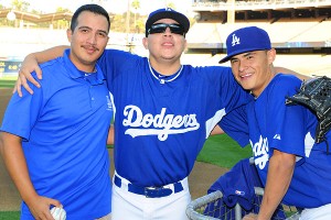 Dodgers worker Javier Herrera takes a fall, and fans raise him up - Los  Angeles Times