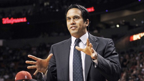 Miami Heat head coach Erik Spoelstra, right, presents a 2011-12