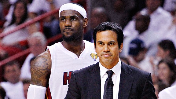 Miami Heat head coach Erik Spoelstra, right, presents a 2011-12