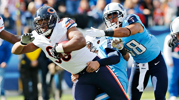 Chicago Bears' Devin Hester warms up before practice at team's