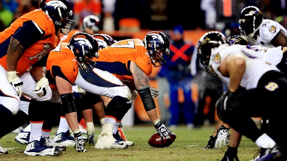 Denver Broncos Manny Ramirez snaps the ball over the head of