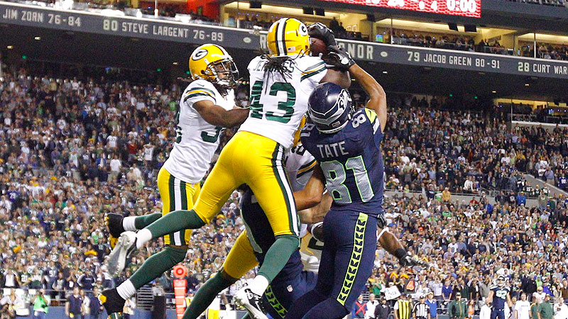 Green Bay Packers' Carroll Dale (84) is pushed and tripped out of