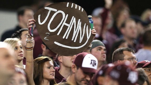 Texas A&M fans showing their love for Johnny Manziel at a game. They do the same at cash registers. 