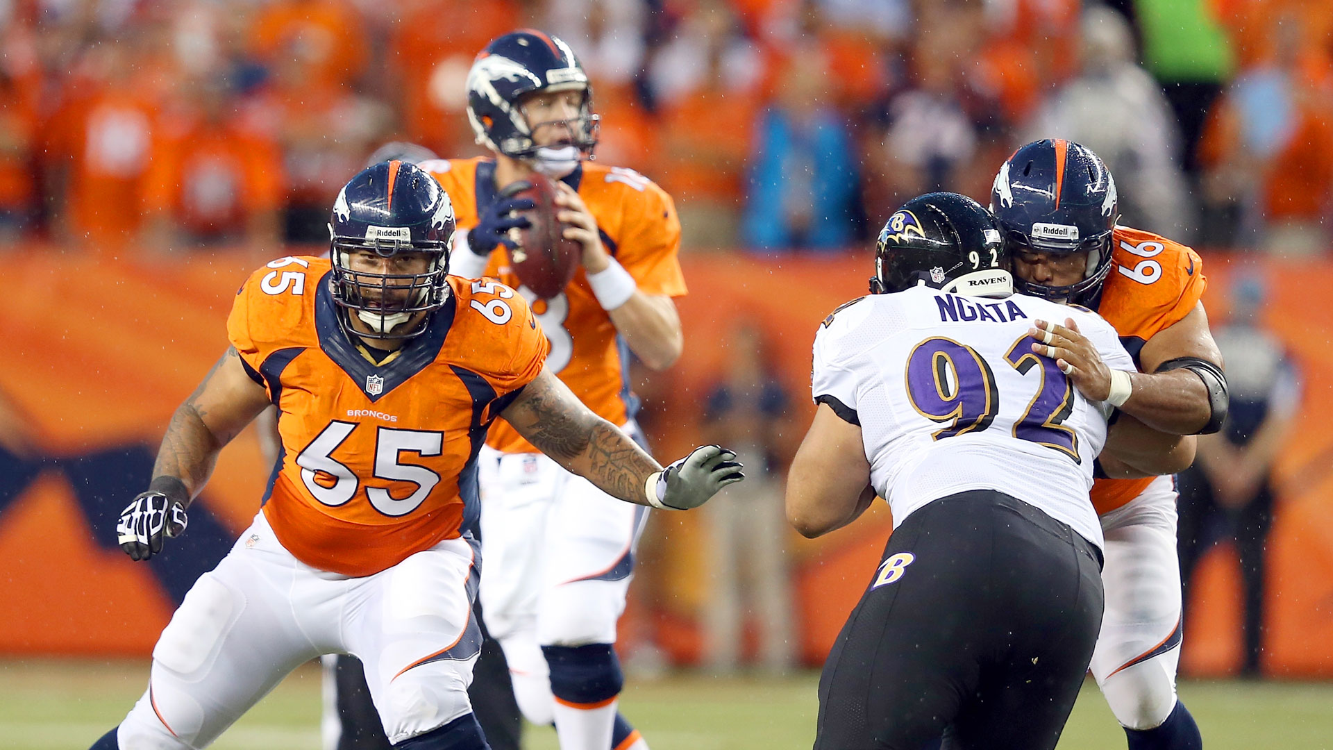 Denver Broncos Manny Ramirez snaps the ball over the head of