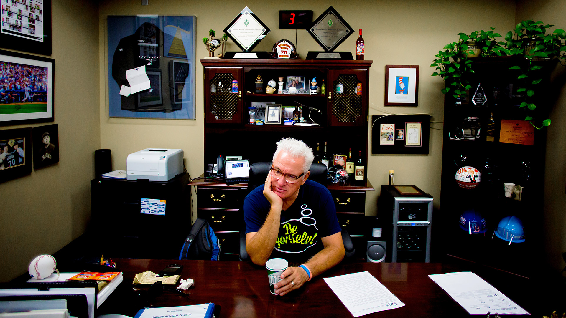 Tampa Bay Rays Manager Joe Maddon adjusts his sunglasses on the first day  of baseball spring training for pitchers and catchers at the Charlotte  Sports Park in Port Charlotte, Fla., Wednesday, Feb.