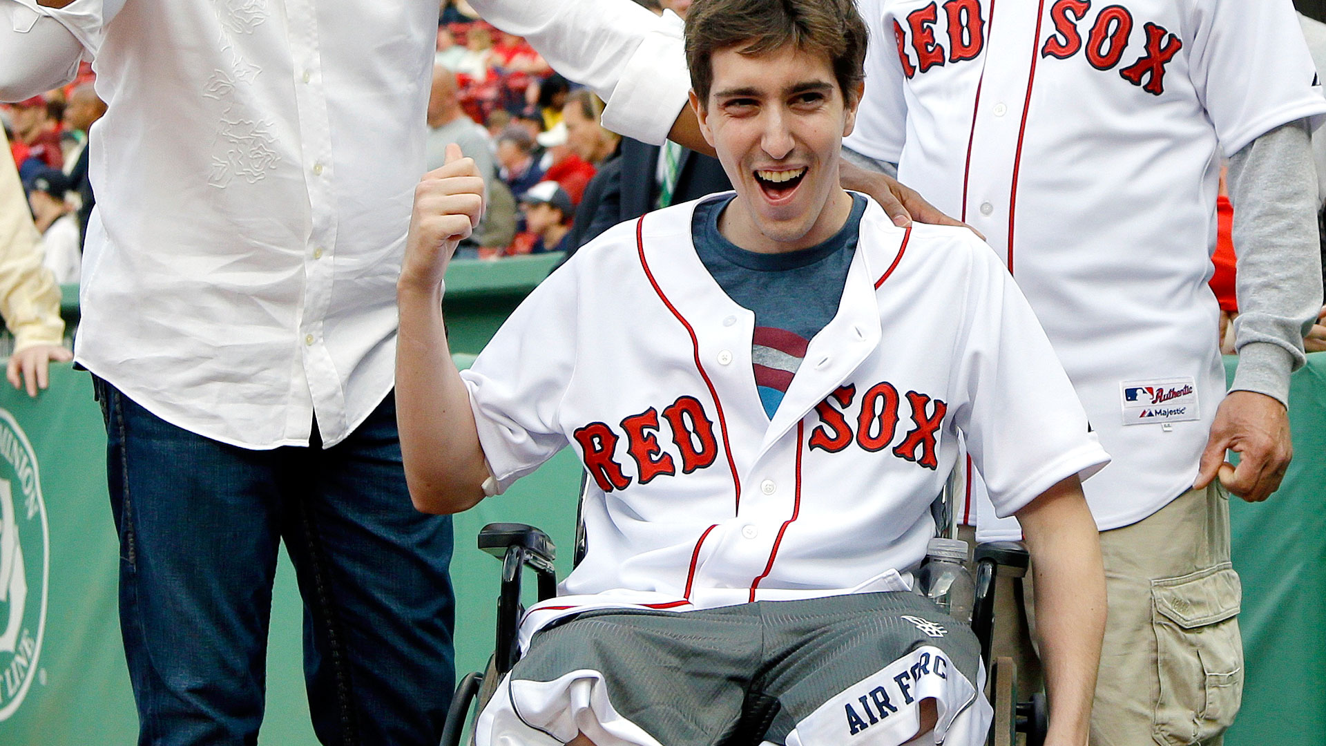 Boston Marathon bombing victim Jeff Bauman, right, stands with Boston Red  Sox's David Ortiz after throwing out a ceremonial first pitch following  ceremonies to honor Ortiz before a baseball game against the