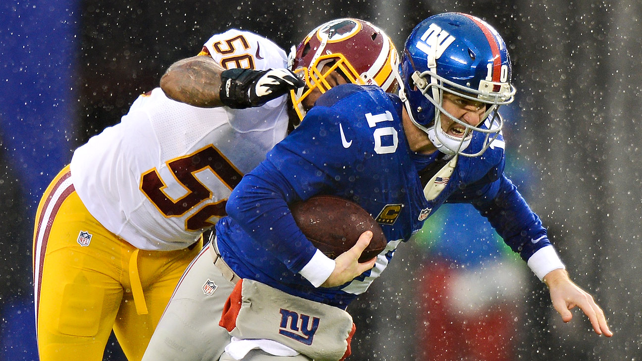 New York Giants Eli Manning puts his hands on his hips after his team does  not convert a fourth down against the Washington Redskins in the fourth  quarter at Giants Stadium in