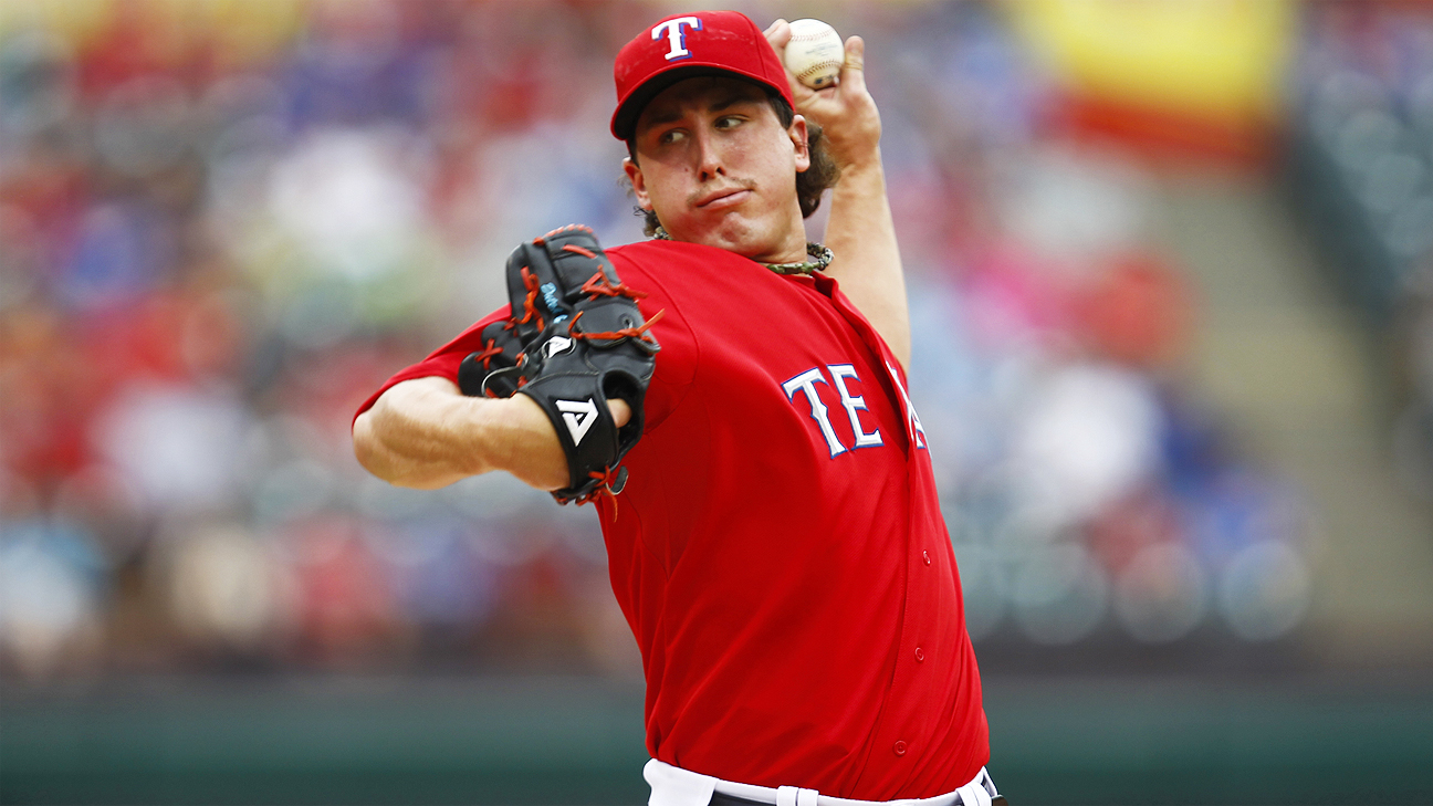 Texas Rangers' Derek Holland is sporting a 'Wild Thing' haircut