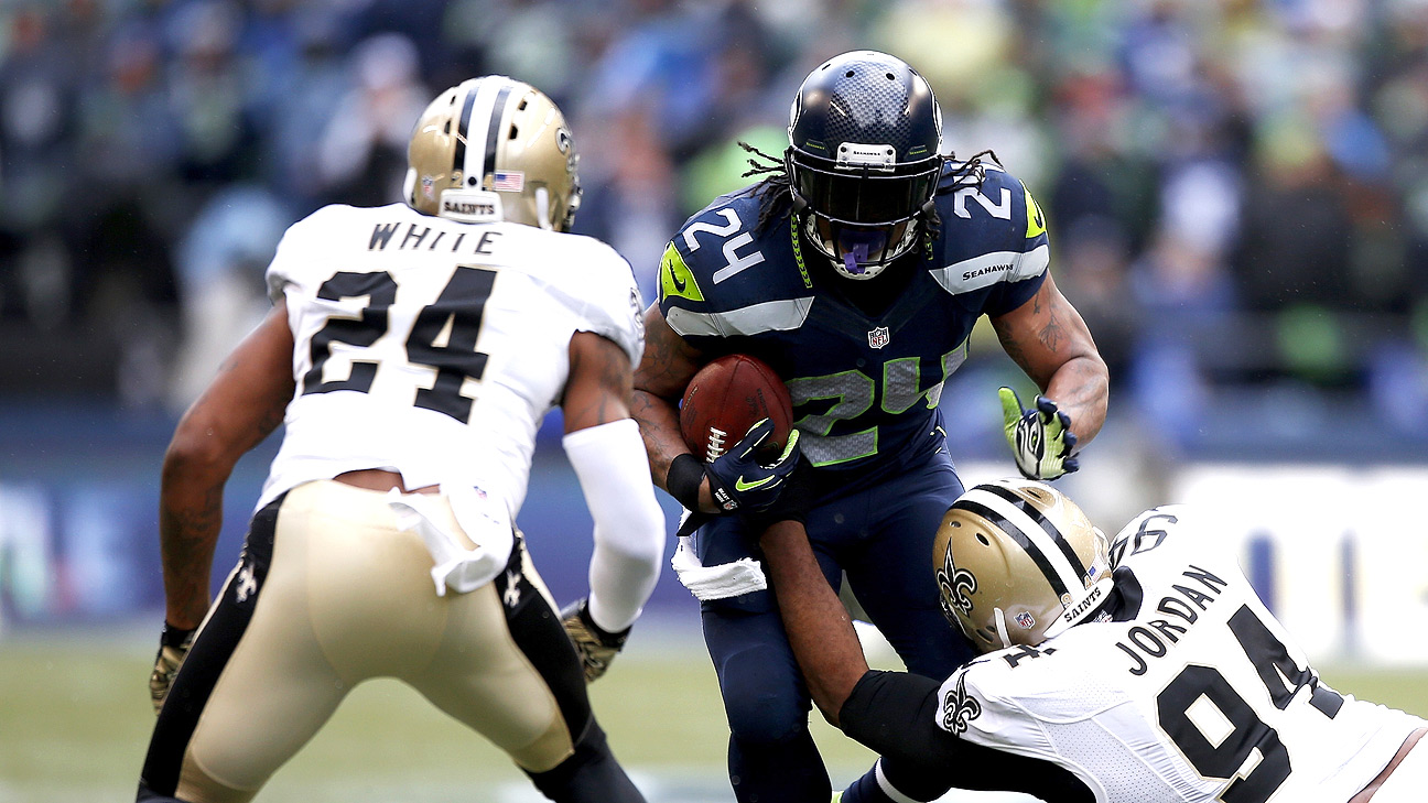 Seattle Seahawks running back Marshawn Lynch (24) walks the sidelines as he  sits out the fourth quarter in the against the New Orleans Saints at  CenturyLink Field in Seattle, Washington on December