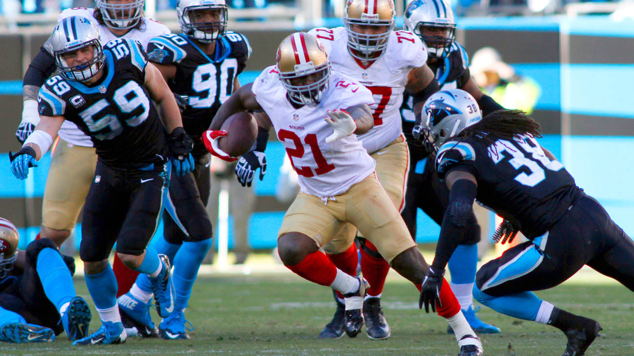 San Francisco 49ers quarterback Colin Kaepernick (7) walks off the field  after the second half of a divisional playoff NFL football game against the  Carolina Panthers, Sunday, Jan. 12, 2014, in Charlotte