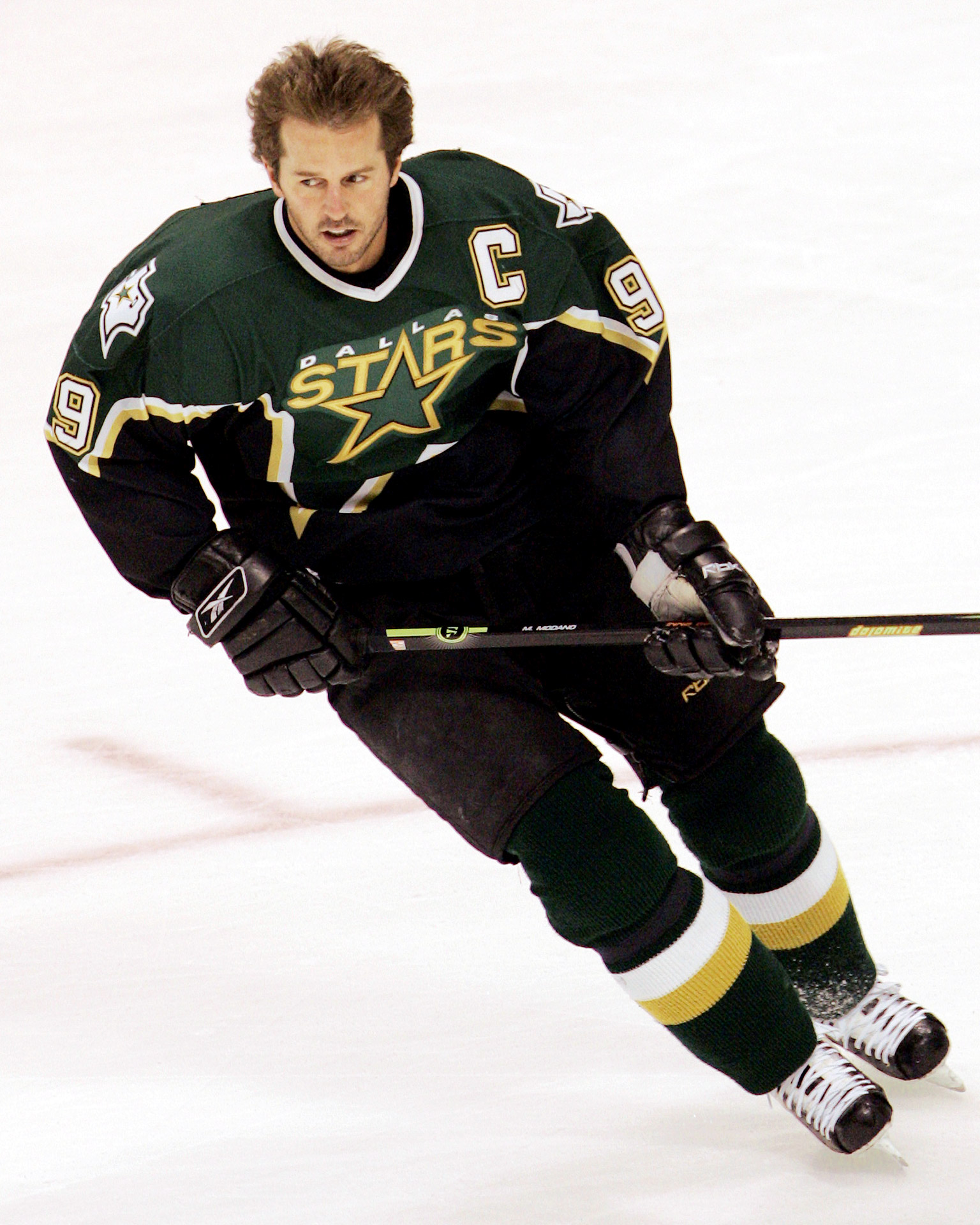Mike Modano of the Minnesota North Stars skates on the ice as he
