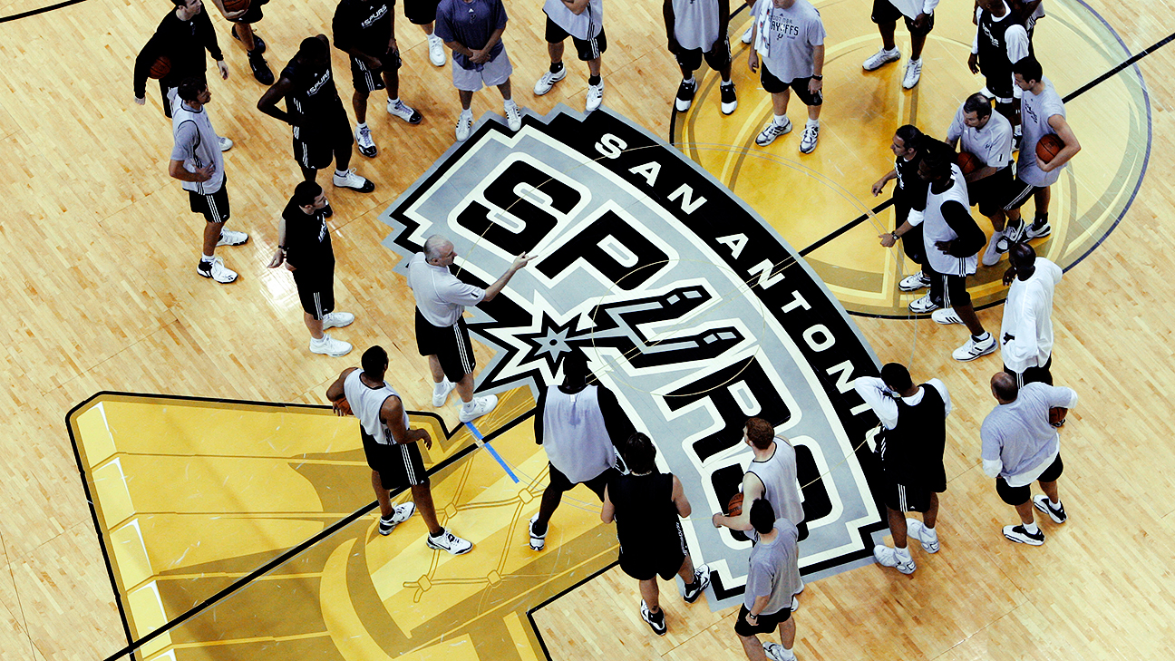 The Larry O'Brien Trophy logo, shown here in 2007, hasn't been painted on a court for the NBA Finals since 2009. It will be back this postseason, sources told ESPN, after an outcry on social media during last year's Finals for it to return.