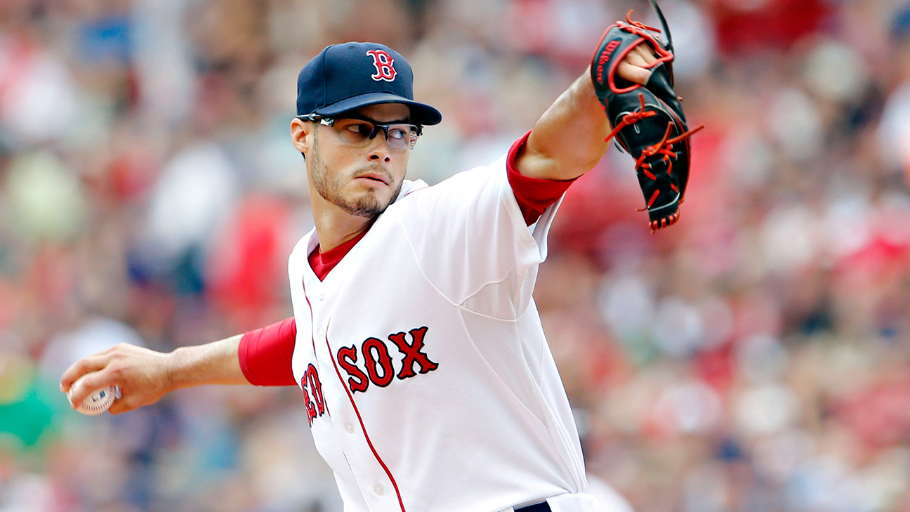 Joe Kelly, suspended Boston Red Sox pitcher, watches from bleachers