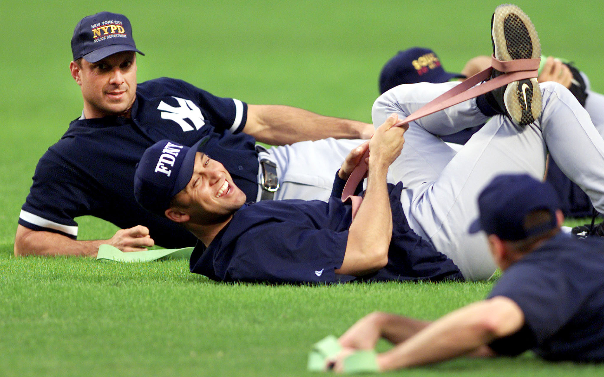 American League's Derek Jeter (L) talks with teammate Miguel