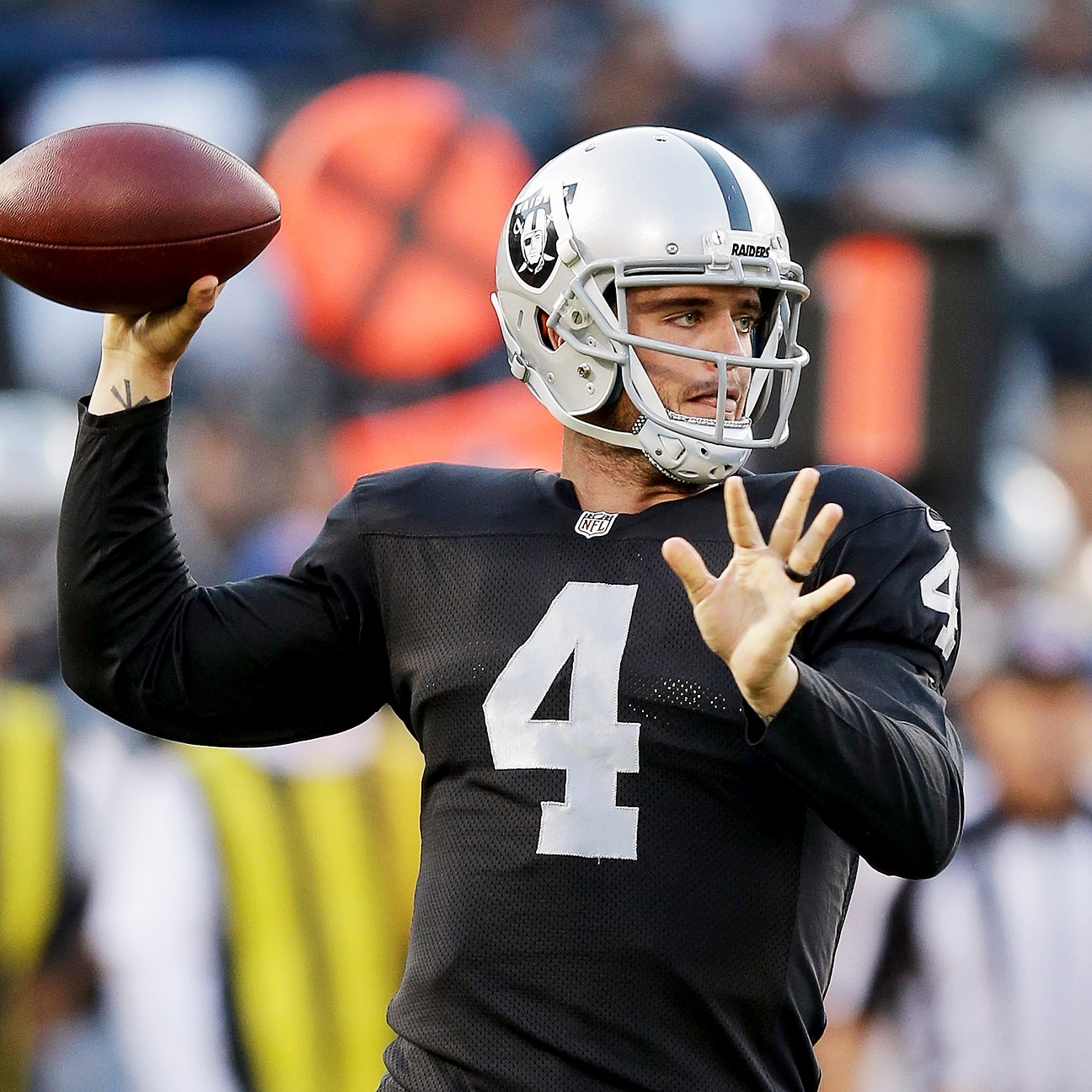 Oakland Raiders quarterback Derek Carr l passes against the Seattle  Seahawks during the second quarter at CenturyLink Field in Seattle,  Washington on November 2, 2014. Carr passed for 194 yards, two touchdown