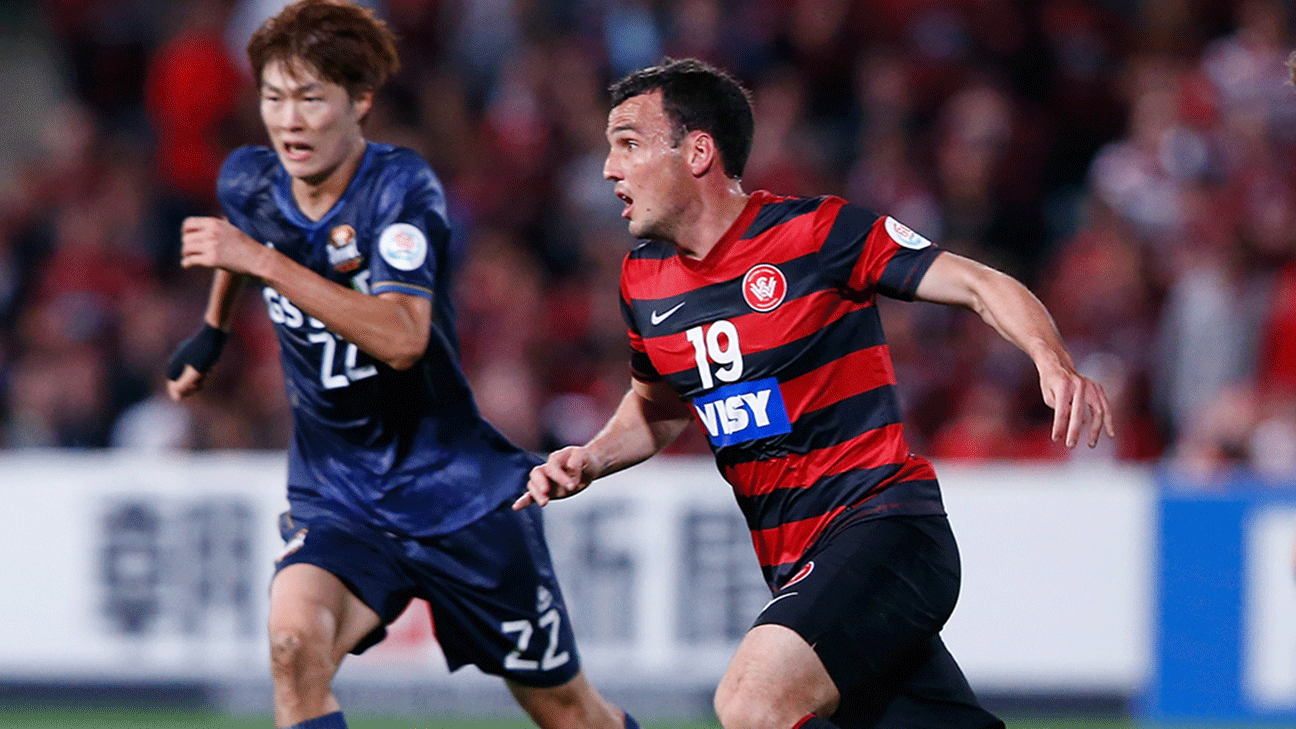 South Korea's FC Seoul striker Dejan Damjanovic, left, fights for